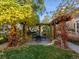 Secluded backyard features a pergola-covered dining area, perfect for outdoor entertaining at 8985 E 29Th Pl, Denver, CO 80238