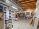 Spacious basement featuring exposed ceiling beams, ample storage solutions, and potential for versatile use at 8985 E 29Th Pl, Denver, CO 80238