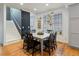 Bright dining room with hardwood floors, large window, and modern decor at 8985 E 29Th Pl, Denver, CO 80238