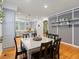 Open concept dining room showcasing hardwood floors and stylish decor at 8985 E 29Th Pl, Denver, CO 80238