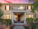 Inviting home exterior features a charming front porch with chairs and a second-story balcony at 8985 E 29Th Pl, Denver, CO 80238