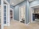 Hallway showing doorways to various rooms with neutral decor at 8985 E 29Th Pl, Denver, CO 80238