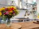 Modern kitchen with stainless steel appliances, a stainless hood, subway tile and butcher block island at 8985 E 29Th Pl, Denver, CO 80238