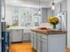 Bright and modern kitchen featuring a butcher block island, stainless steel appliances, and ample natural light at 8985 E 29Th Pl, Denver, CO 80238