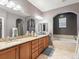 Spacious bathroom with double sinks, granite countertops, and soaking tub at 8985 E 29Th Pl, Denver, CO 80238