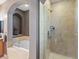 Bathroom featuring large bathtub and glass-enclosed shower at 8985 E 29Th Pl, Denver, CO 80238