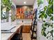 Home office with custom built-in shelves, lots of books, natural light, and space for creativity at 8985 E 29Th Pl, Denver, CO 80238