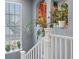 Staircase landing with window, houseplants, and built-in bookshelves at 8985 E 29Th Pl, Denver, CO 80238