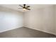 Well-lit bedroom featuring ceiling fan and carpet flooring at 2000 E 12Th Ave # 15D, Denver, CO 80206