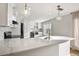 Modern kitchen with island and stainless steel appliances at 2000 E 12Th Ave # 15D, Denver, CO 80206