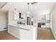 Modern white kitchen with stainless steel appliances at 2000 E 12Th Ave # 15D, Denver, CO 80206