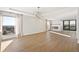 Sunlit living room with hardwood floors and fireplace at 2000 E 12Th Ave # 15D, Denver, CO 80206