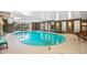 Indoor pool with seating and large windows at 2000 E 12Th Ave # 15D, Denver, CO 80206