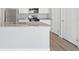 Bright kitchen featuring white cabinets, granite countertops, stainless steel appliances, and modern fixtures at 7307 Dolores Ave, Frederick, CO 80530