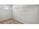 Spacious walk-in closet with carpet, wire shelving, and a window for natural light at 7307 Dolores Ave, Frederick, CO 80530
