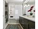 Stylish bathroom featuring a double vanity, subway tiled shower and marble countertop at 836 E 17Th Ave # 1A, Denver, CO 80218