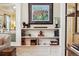 Stylish built-in shelves adorned with books and decor in a cozy living space at 836 E 17Th Ave # 1A, Denver, CO 80218