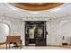 Elegant elevator entrance featuring ornate wrought iron doors and marble walls, showcasing historic charm at 836 E 17Th Ave # 1A, Denver, CO 80218