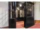 Vintage elevator interior with ornate metalwork and classic detailing, blending historic appeal with modern safety at 836 E 17Th Ave # 1A, Denver, CO 80218