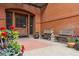 Charming entrance with potted flowers, benches, and brick exterior, offering a warm welcome at 836 E 17Th Ave # 1A, Denver, CO 80218