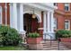 Grand entrance featuring stately columns, detailed trim, and a hanging lantern at 836 E 17Th Ave # 1A, Denver, CO 80218