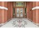 Elegant entryway with ornate tile flooring and intricate glasswork above the door at 836 E 17Th Ave # 1A, Denver, CO 80218