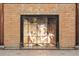 Close-up of a unique fireplace featuring a detailed angel mural set within decorative brickwork at 836 E 17Th Ave # 1A, Denver, CO 80218