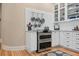 Charming kitchen with white cabinets, stainless steel appliances, and subway tile backsplash at 836 E 17Th Ave # 1A, Denver, CO 80218