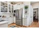Bright kitchen with white cabinets, subway tile backsplash, and stainless steel appliances at 836 E 17Th Ave # 1A, Denver, CO 80218