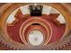 Dramatic view down a spiral staircase highlighting the building's architectural elegance and intricate design details at 836 E 17Th Ave # 1A, Denver, CO 80218