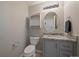 Neat half bathroom features a modern vanity, granite counter, and classic toilet at 6786 Halifax Ave, Castle Rock, CO 80104