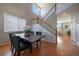 Open dining area with wooden floors, modern table, and staircase access at 6786 Halifax Ave, Castle Rock, CO 80104
