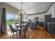 Bright eat-in kitchen with granite counters, stainless steel appliances, and sliding doors to the backyard at 6786 Halifax Ave, Castle Rock, CO 80104