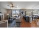 Bright living room with hardwood floors, large windows, fireplace, and stylish contemporary decor at 6786 Halifax Ave, Castle Rock, CO 80104