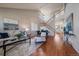 Grand living room with high ceilings, hardwood floors, staircase, and abundant natural light at 6786 Halifax Ave, Castle Rock, CO 80104