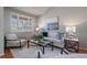 Bright living room features modern decor, large windows, and comfortable seating at 6786 Halifax Ave, Castle Rock, CO 80104