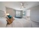 Comfortable primary bedroom featuring plush carpet, a large window, and serene decor at 6786 Halifax Ave, Castle Rock, CO 80104