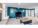 Basement area featuring a TV, carpet, and adjacent bathroom at 6211 S Garfield Dr, Centennial, CO 80121