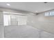 Spacious basement featuring neutral carpet, white trim, and ample lighting at 6211 S Garfield Dr, Centennial, CO 80121