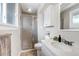Well-lit bathroom with a shower, vanity, and modern fixtures at 6211 S Garfield Dr, Centennial, CO 80121