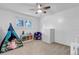 Bedroom with large window, neutral carpet, and ample space for toys at 6211 S Garfield Dr, Centennial, CO 80121