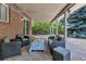 Stylish covered patio with brick accents and comfortable outdoor seating at 6211 S Garfield Dr, Centennial, CO 80121
