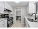 Bright kitchen with stainless steel appliances, sleek countertops, and plenty of storage space at 6211 S Garfield Dr, Centennial, CO 80121
