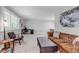 Spacious living room with large windows, plantation shutters, and comfortable seating at 6211 S Garfield Dr, Centennial, CO 80121