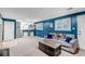 Cozy living room with blue accent wall, comfortable seating, and bright windows at 6211 S Garfield Dr, Centennial, CO 80121
