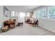 Bright living room featuring comfortable seating, large windows with plantation shutters, and neutral decor at 6211 S Garfield Dr, Centennial, CO 80121