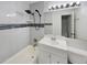 Updated bathroom with a shower/tub combo and modern vanity at 8019 Wolff St # H, Westminster, CO 80031