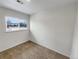 Simple bedroom with neutral walls and carpet at 8019 Wolff St # H, Westminster, CO 80031