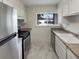 Clean kitchen featuring stainless steel appliances and white cabinets at 8019 Wolff St # H, Westminster, CO 80031