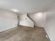 Living room with carpet and access to lower level at 8019 Wolff St # H, Westminster, CO 80031